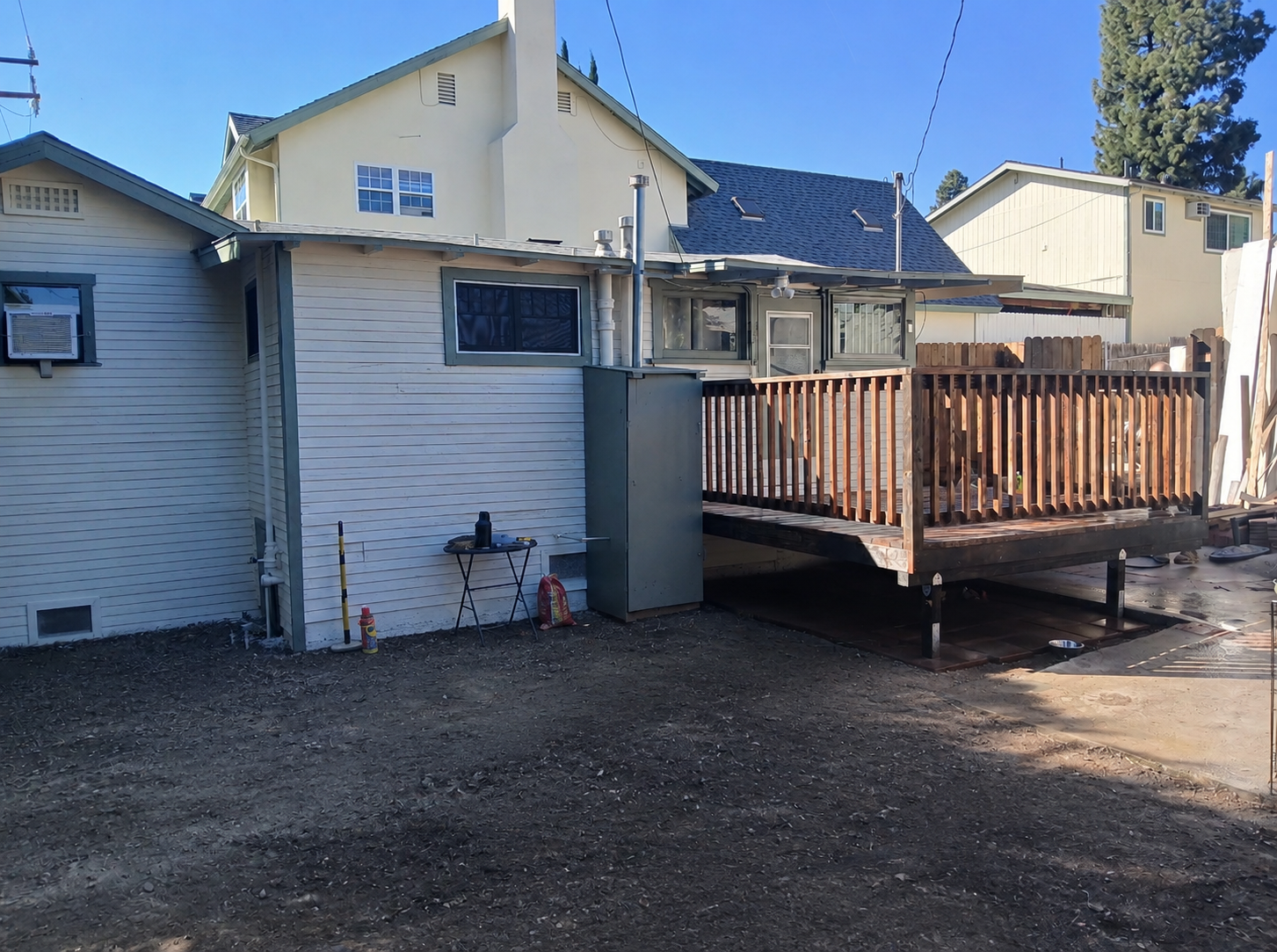 After: freshly painted house with new deck