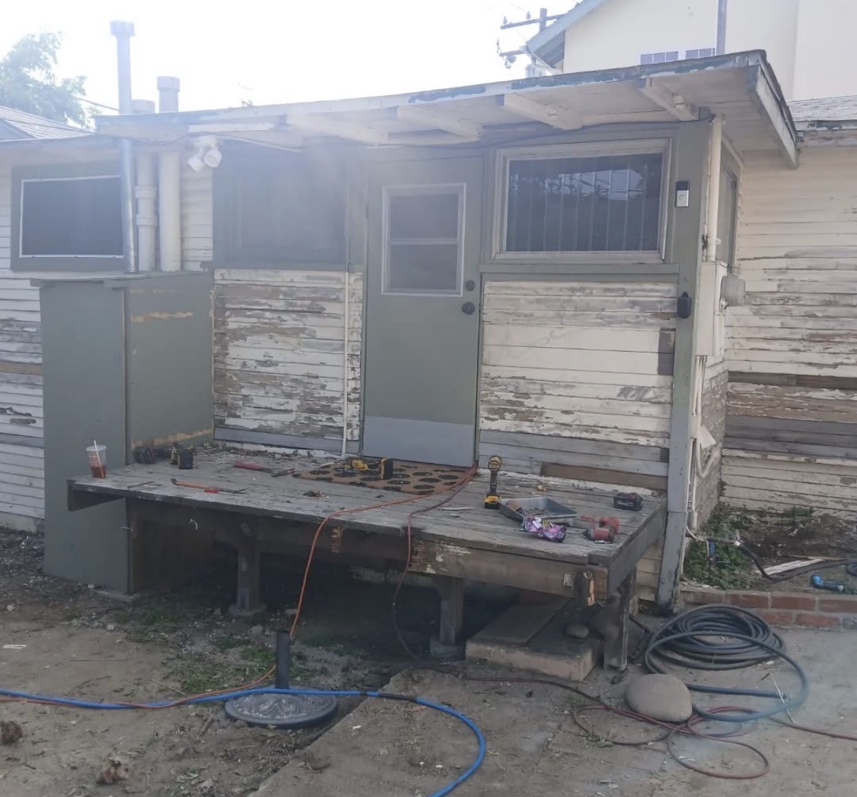Before: peeling paint and rotted porch