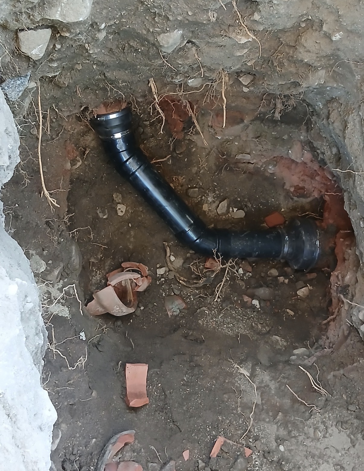 New black ABS drain pipe installed