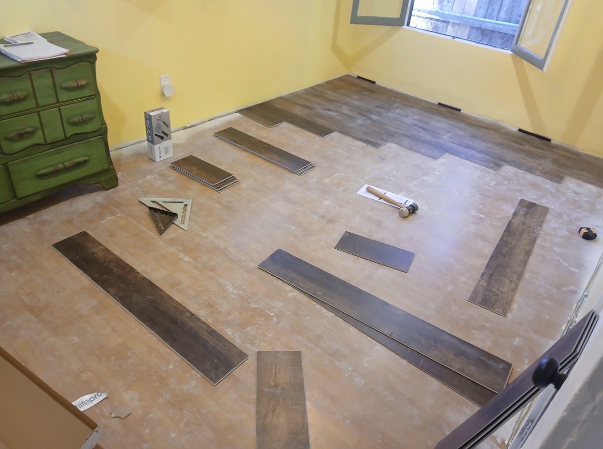 Vinyl plank flooring mid-installation